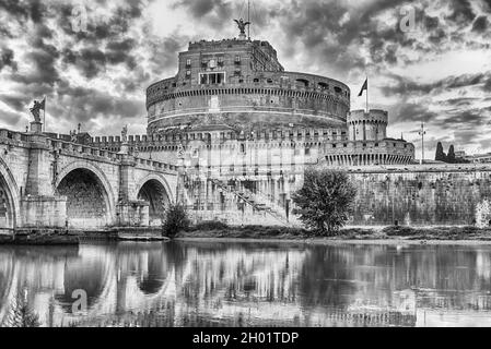 View of Castel Sant'Angelo fortress and bridge with beautiful reflections on the Tiber River in Rome, Italy. Aka Mausoleum of Hadrian, the building wa Stock Photo