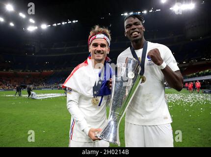 MILAN, ITALY - OCTOBER 10: Antoine Griezmann and Paul Pogba of France celebrates with The UEFA Nations League Trophy following their team's victory in the UEFA Nations League 2021 Final match between Spain and France at San Siro Stadium on October 10, 2021 in Milan, Italy. (Photo by Emilio Andreoli - UEFA/UEFA via Getty Images/Insidefoto/Insidefoto) Credit: insidefoto srl/Alamy Live News Stock Photo