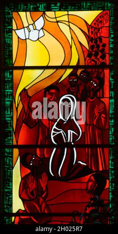 Colorful stained glass windows filled with art from a Catholic church. Salvador Bahia Brazil. Stock Photo