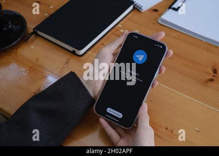 CHIANG MAI, THAILAND OCT 10 2021 : Telegram application icon on Apple iPhone 13 screen close-up. Telegram app icon. Telegram is an online social media Stock Photo