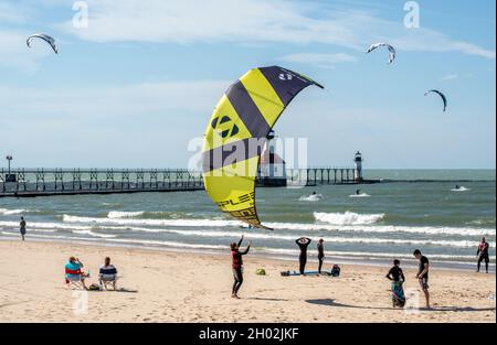 St Joseph MI USA, Sept 26, 2021; active people surf and kite board on Lake Michigan Stock Photo