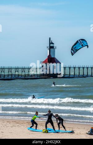St Joseph MI USA, Sept 26, 2021; lots of activity around the light house, as a wind makes conditions right for kite surfers Stock Photo