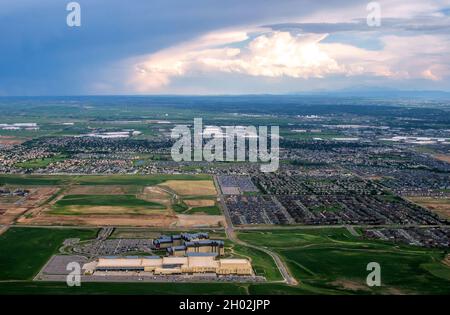 Aurora Colorado June 7 2021 USA ; view from an airplane of a large hotel and many homes and businesses near Denver International airport Stock Photo