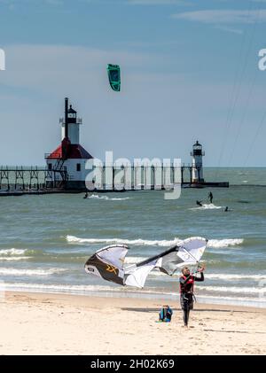 St Joseph MI USA, Sept 26, 2021; Kite boarders play on the beach of Tiscornia park, on the shores of Lake Michigan in the USA Stock Photo