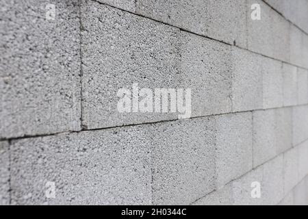 Gray concrete wall made of rectangular blocks Stock Photo