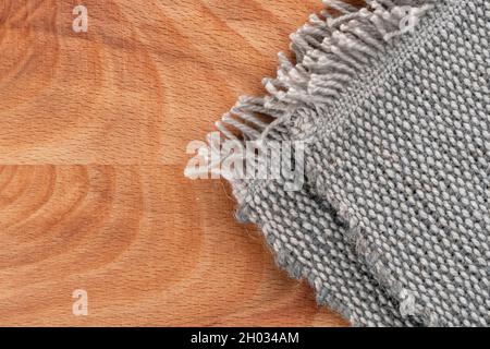 Jute rough knitted canvas on a wooden vintage rustic background. Macro. Textured burlap fabric close up Stock Photo