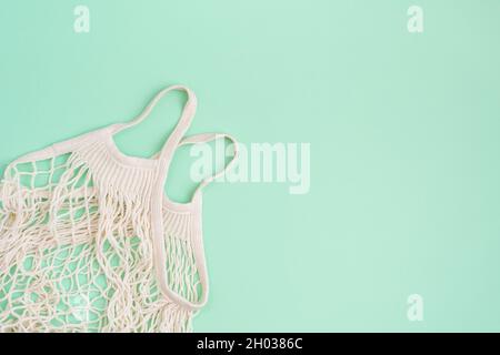 Eco bag on turquoise paper background Stock Photo