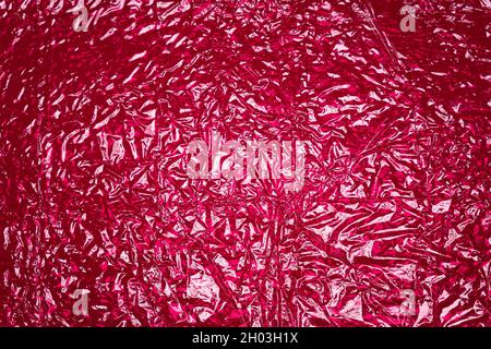 hot pink shiny reflective textured plastic background Stock Photo