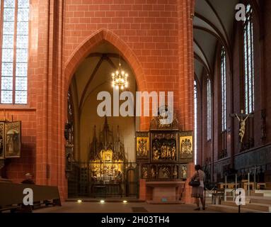 View of the Maria-Schlaf-Altar in the chapel 'Marienkapelle' and the gothic altar 'Apostelabschiedsaltar' from 1523 at the corner of the choir inside... Stock Photo