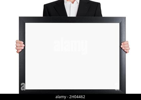 Businessman holds a big white blank signboard with copy space on isolated white background. Stock Photo