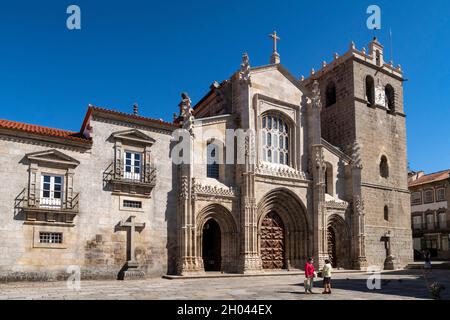 Two women talk in front of the Our Lady of the Assumption Cathedral, Lamego, Portugal, Europe Stock Photo