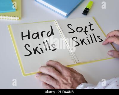 The man wrote phrases Hard skills and soft skills. Stock Photo
