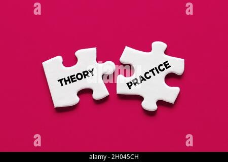 Theory and practice relationship or connection concept. Two puzzle pieces with the words theory and practice are connecting.