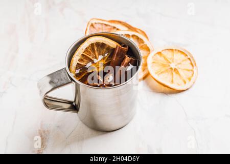 Apple cider in metal mug on the rustic background. Selective focus. Shallow depth of field. Stock Photo