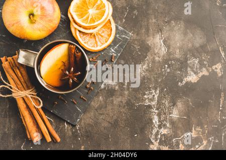 Apple cider in metal mug on the rustic background. Selective focus. Shallow depth of field. Stock Photo