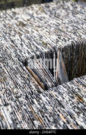 Slate roof tiles at Llechwedd Slate Mine, Zip World Slate Caverns, Snowdonia, Wales, UK Stock Photo