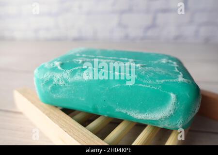 Soap and bubbles on a case on table  Stock Photo