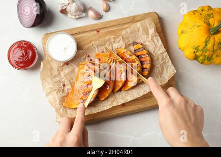 Concept of tasty eating with baked pumpkin . Stock Photo