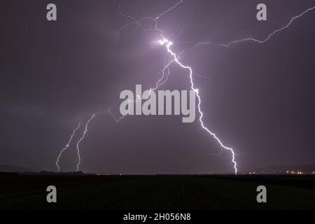 Lightning Strike at dark stormy and rainy night Stock Photo