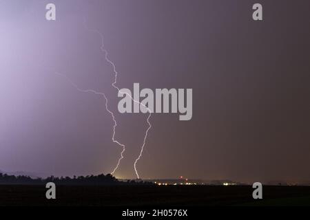 Lightning Strike at dark stormy and rainy night Stock Photo