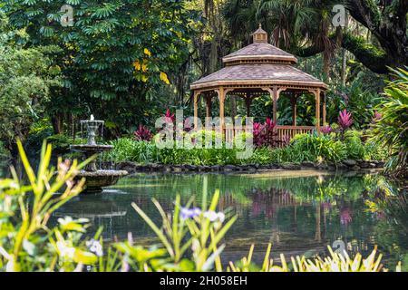 Scenic wooden gazebo and pond in the formal gardens at Washington Oaks Gardens State Park in Palm Coast, Florida. (USA) Stock Photo