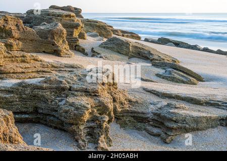 Coquina rocks along the Atlantic shoreline at Washington Oaks Gardens State Park in Palm Coast, Flagler County, Florida. (USA) Stock Photo