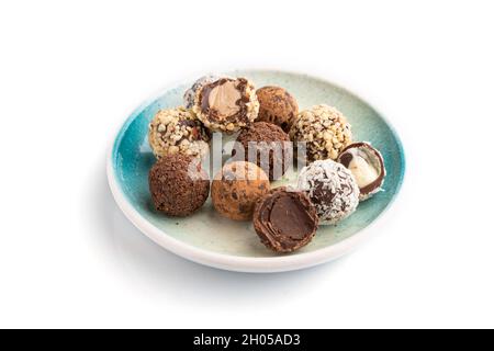 Chocolate truffle candies isolated on white background. side view, close up. Stock Photo