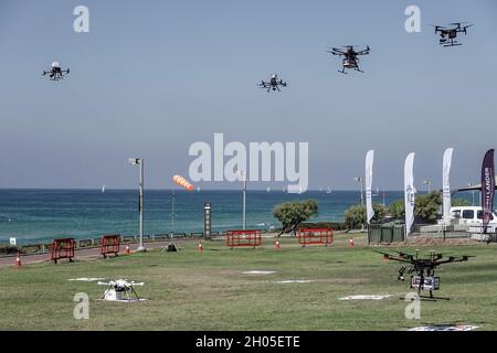 Tel Aviv, Israel. 11th October, 2021. The Israel Innovation Authority (IIA), Ayalon Highways, Ministry of Transportation and Civil Aviation Authority jointly conduct a demonstration of the INDI project, the Israel National Drone Initiative, at stage three of eight in a two year plan to create a national mesh network of drones carrying payloads in a managed airspace implementing an autonomous control system operated at Ayalon Highways Unmanned Aerial Systems Centers. Stage three includes 3,000 sorties above the Tel Aviv metropolitan area and a flight transport in Brazil, controlled by the manag