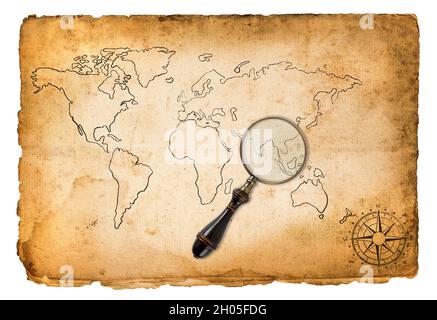 Old map with wind rose and magnifying glass isolated on white Stock Photo