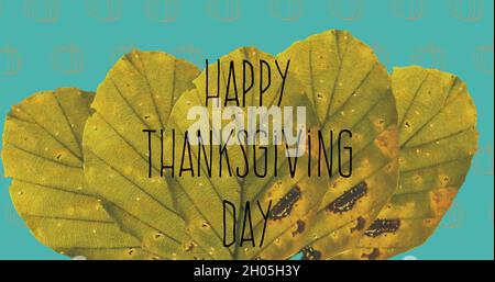 Happy thanksgiving day text on autumn leaves against pumpkin icons in seamless on yellow background Stock Photo