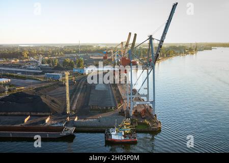 Swinoujscie, Poland - Transshipment port for coal, apatite, phosphate and iron ore. Industrial area seen from above, lng terminal in the b Stock Photo