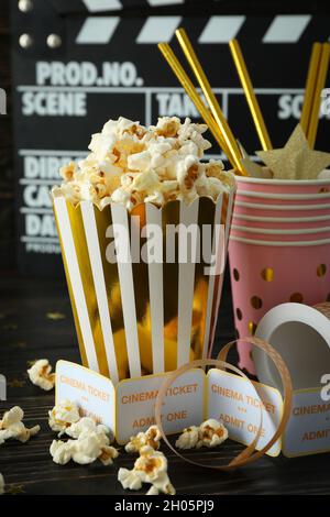 Concept of cinema accessories on wooden background. Stock Photo