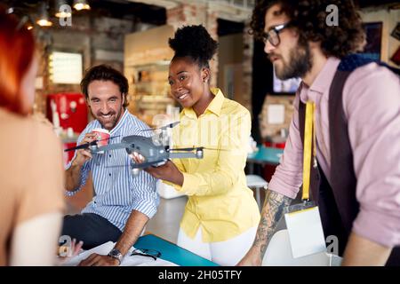 Young colleagues collaborating on a projecting the drone together Stock Photo