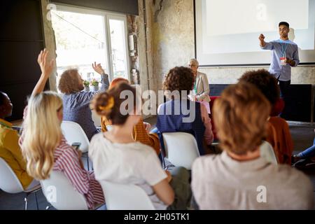 Young afro american employee holding a presentation at the office Stock Photo