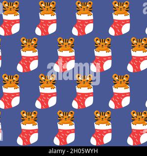 Tiger in christmas gift sock seamless pattern. Cool baby repeatable print. Vector illustration on blue background Stock Vector