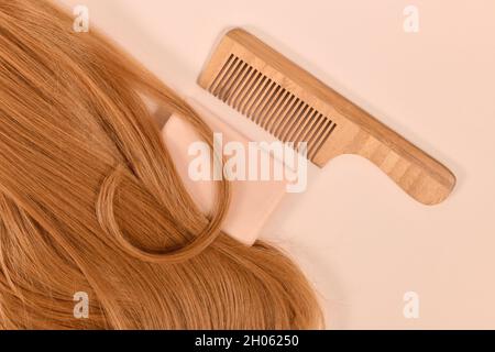 Healthy hair care routine with eco friendly solid shampoo bar and wooden comb Stock Photo
