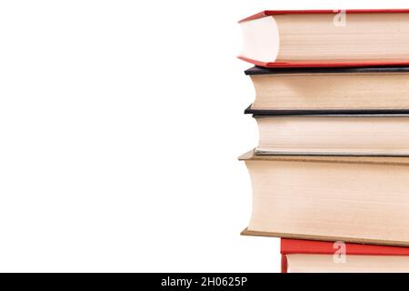 Stack of old hardcover books on side of white background with copy space Stock Photo
