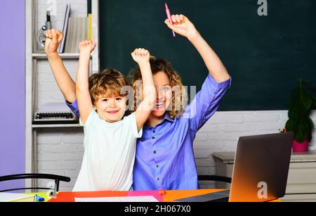 Back to school. Home schooling. Parenting. Education. Excited family learning together. Child in school. Success Stock Photo