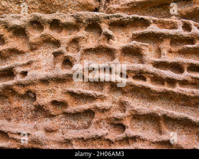Natural patterns in sandstone eroded by the action of the weather. Stock Photo