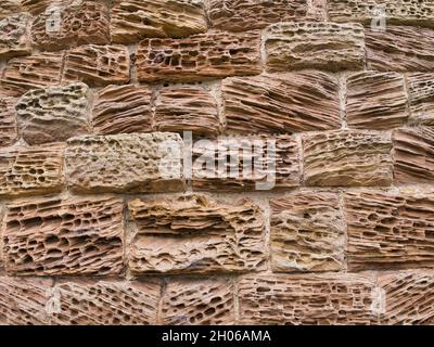 Natural patterns in sandstone blocks eroded by the action of the weather. Stock Photo
