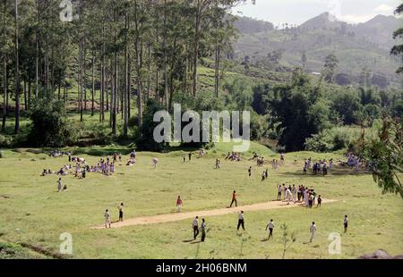 SRI LANKA:  Children enjoying a communal sports event in an open area  on the vast scenic plantations in The Tea Trail on the Norwood Estate Stock Photo