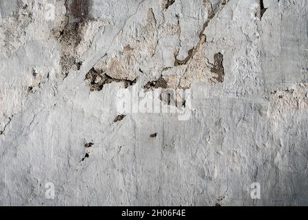 Old plastered brick wall, aged and weathered, abstract texture background Stock Photo
