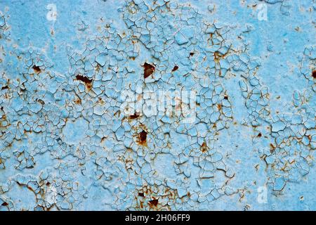 Cracked paint and rusty metal background. Stock Photo