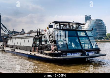 A City Cruises River Tour Boat With The London Assembly Building  In The Backround, London, UK. Stock Photo