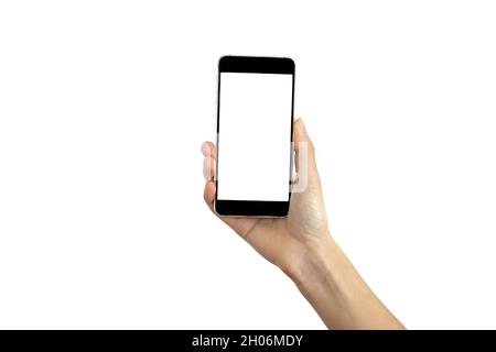 Woman hand holding black smartphone isolated on white background. Mockup image of woman using mobile phone with blank white screen. Stock Photo