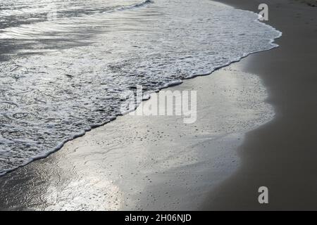 Mediterranean beach and silver-gray reflection in water abstract waves travel and relax background Stock Photo