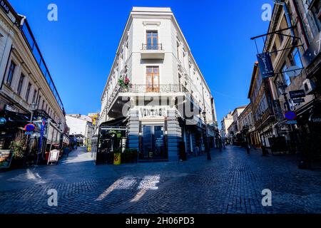 Bucharest, Romania, 22 November 2020 - Street with old buidings in the historic center  on a sunny autumn day Stock Photo