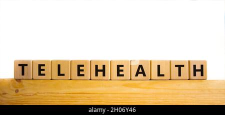 Time to telehealth symbol. Wooden cubes with the word 'telehealth ...