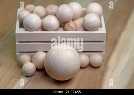 Many wooden balls in a wooden box Stock Photo