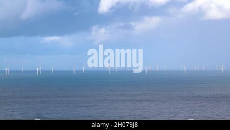 Gwynt y Môr (Sea wind) 576-megawatt offshore electricity generating wind farm; 160 x 150m high wind turbines in action, Colwyn Bay Wales Stock Photo